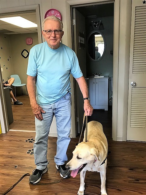 Chris picking up Gracie from the Refuge